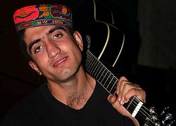 Young Tajikistani man with guitar.jpg