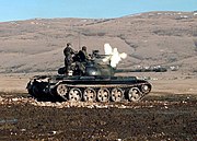 Fil:HVO Army T-55 Glamoc firing MG.jpg